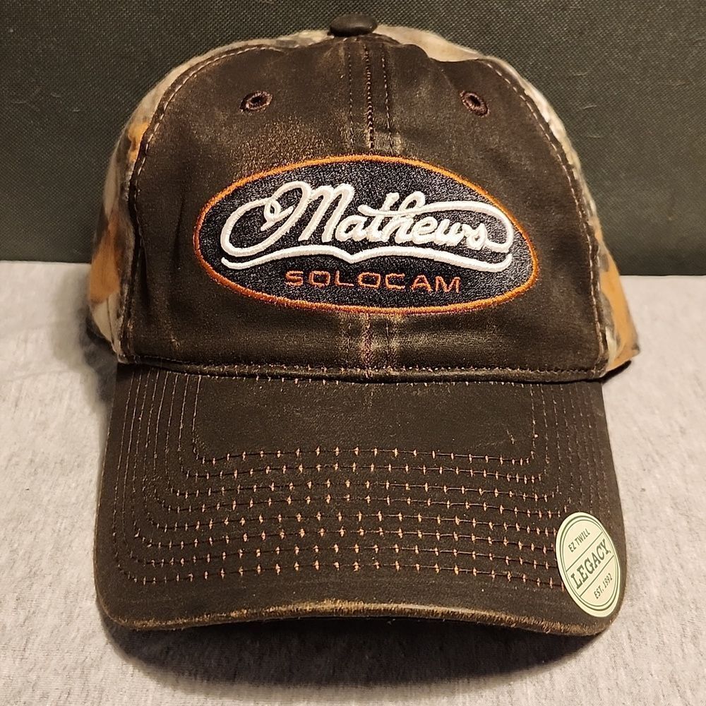 Mathews Solocam Faux leather look camo with rust Velcroback Hat - New